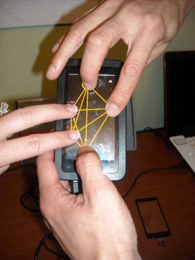 A live demonstration of sensitivity to three hands at once, from Synaptics' multitouch demo.